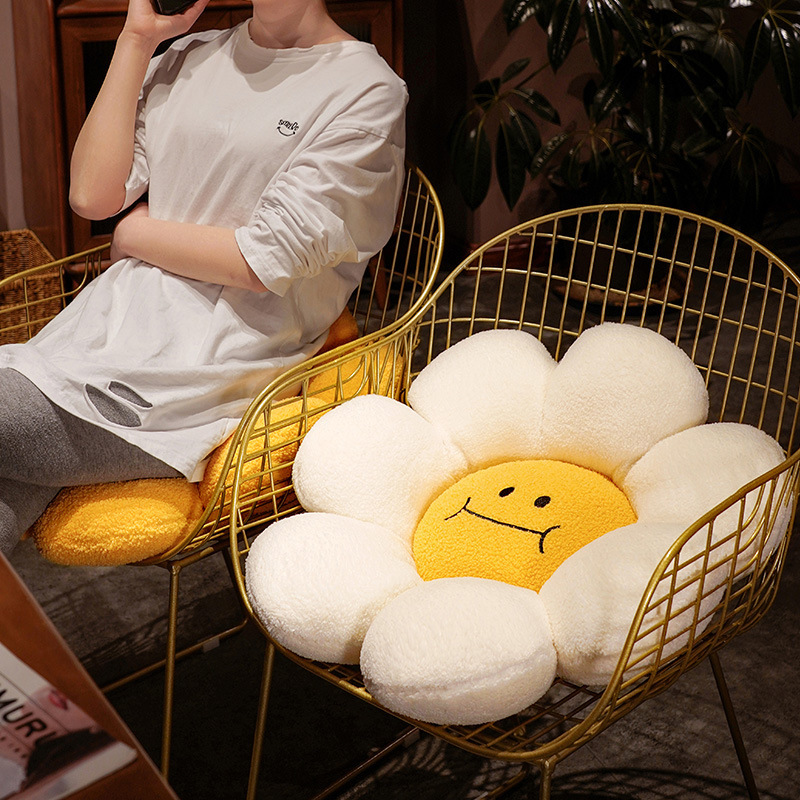 Sunflower plush cushion placed on a chair as a soft seat pad, round flower design with supportive plush filling