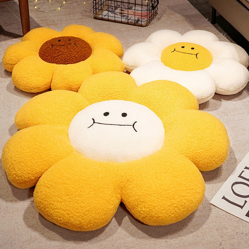Sunflower plush floor cushions in three color variations arranged on living room floor, soft fluffy texture with smiling face design for cozy seating and decor