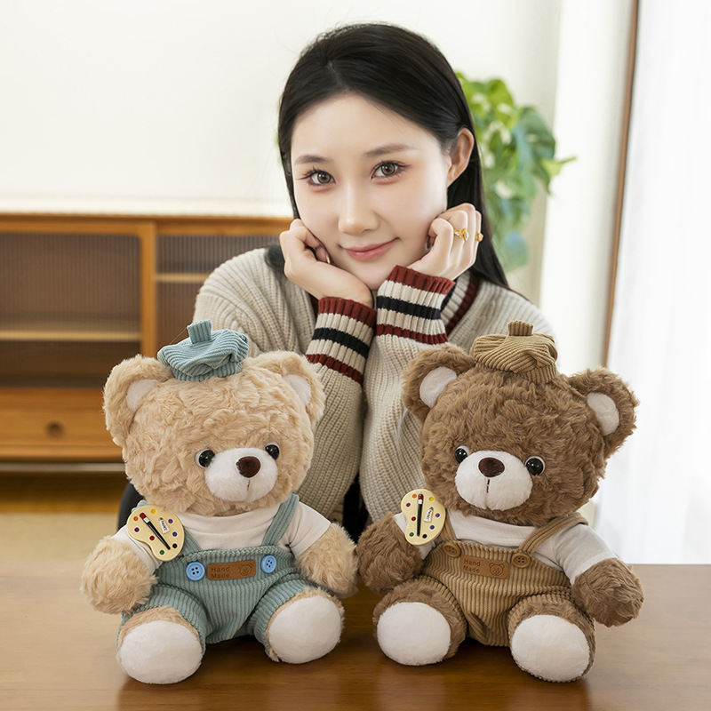 Mocha bear plush toys in pastel outfits displayed on a table in a warm home setting, soft stuffed animals ideal for decor and gifting