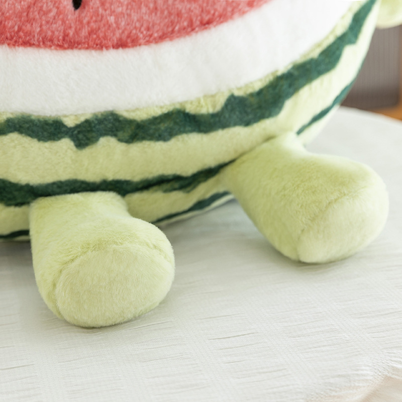 Detail view of watermelon plush pillow base and soft stuffed feet