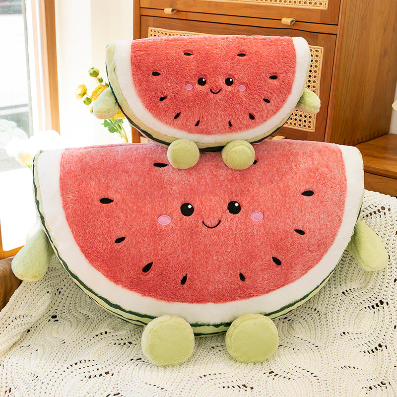 Watermelon plush pillow displayed on sofa in cozy living room setting, showing soft texture and cheerful smiling design