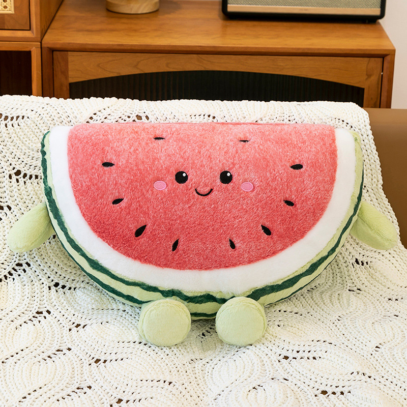 Watermelon plush pillow with soft texture displayed on sofa indoors