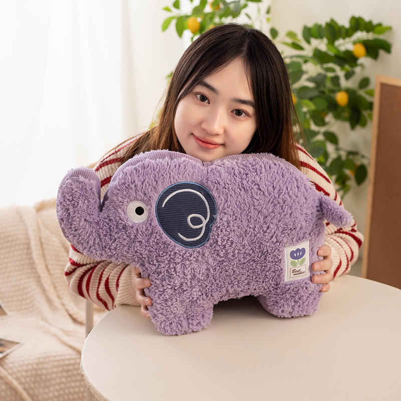 Purple elephant maggie animal plush pillow shown in close-up, featuring soft textured fabric, embroidered ear detail and compact 45cm cushion design