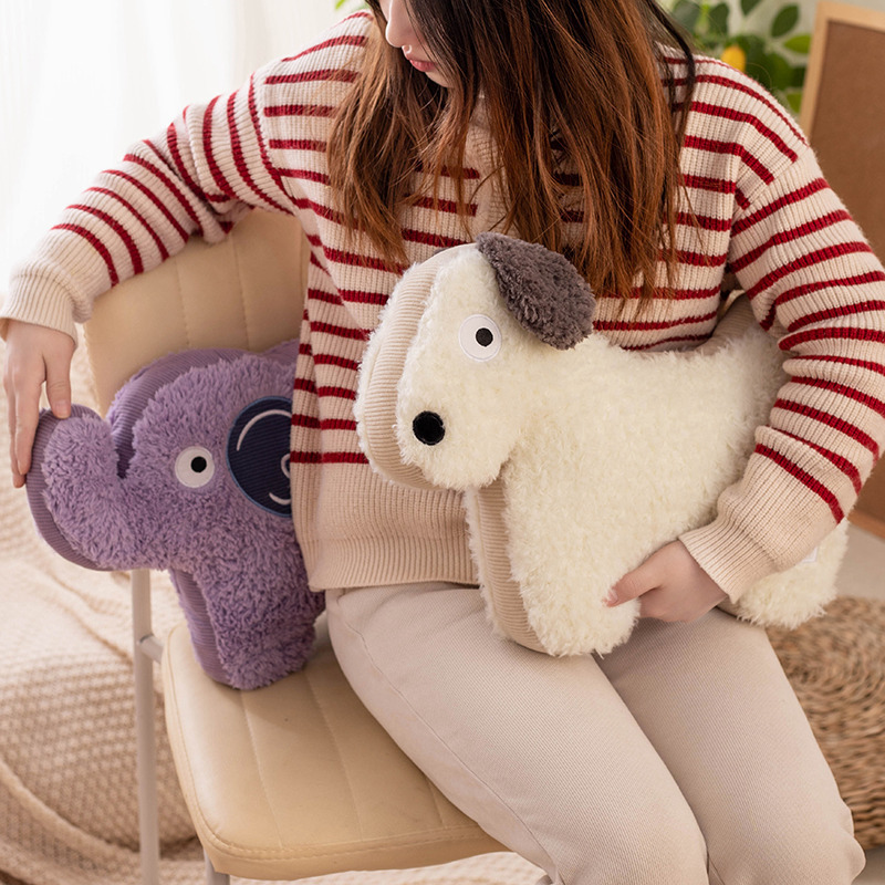Dog and elephant maggie animal plush pillows styled on a chair, showing soft texture and comfortable support for everyday seating