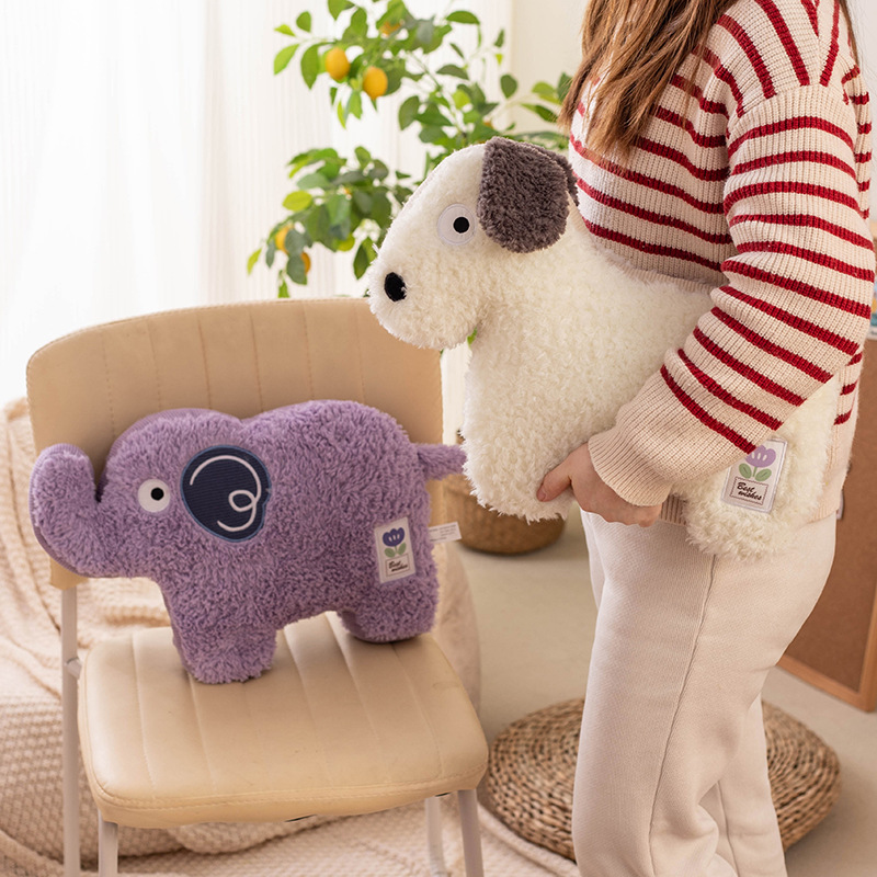 Maggie animal elephant plush pillow placed on a chair with dog design cushion, highlighting thick PP cotton filling and cozy decorative use