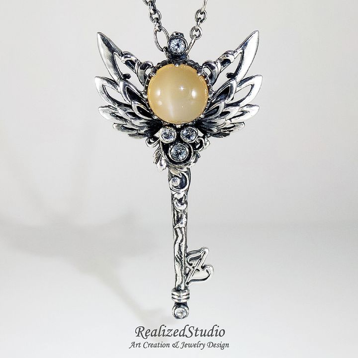 P21125-02 004 angel-wings-key-motif-pendant-orange-moonstone RealizedStudio Jewelry