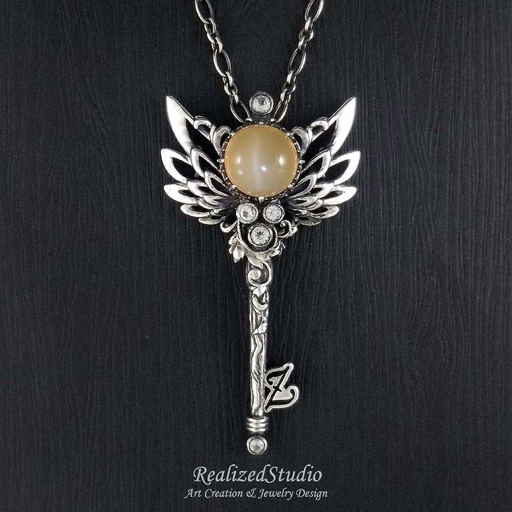 P21125-02 001 angel-wings-key-motif-pendant-orange-moonstone RealizedStudio Jewelry