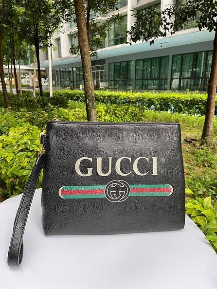 Gucci print online clutch