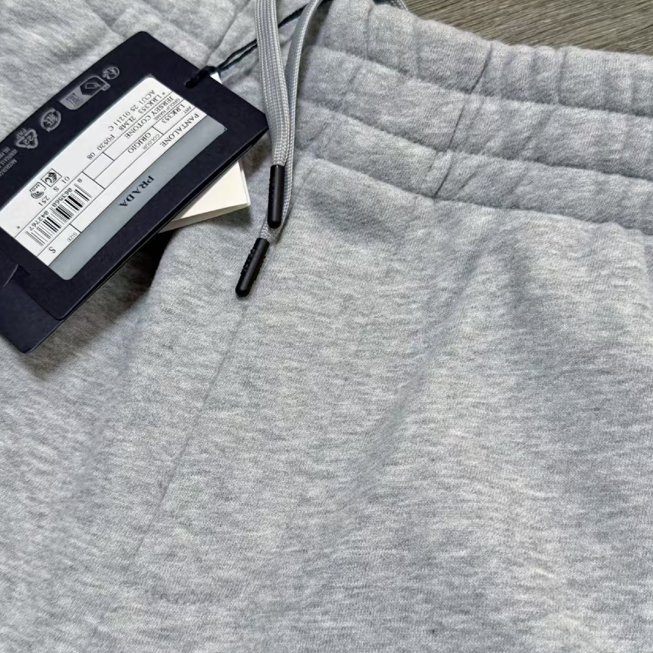 Prada Triangle Metal Logo Jogger Pants-07