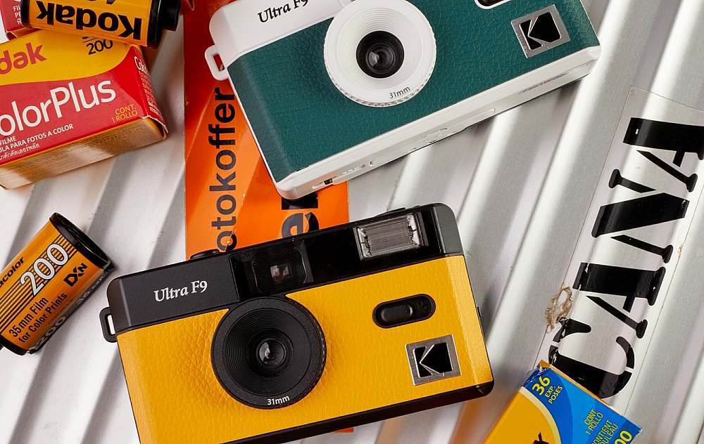KODAK-Film-Camera-ULTRA-F9-Green-and-Yellow-on-camera-case-among-film-packages