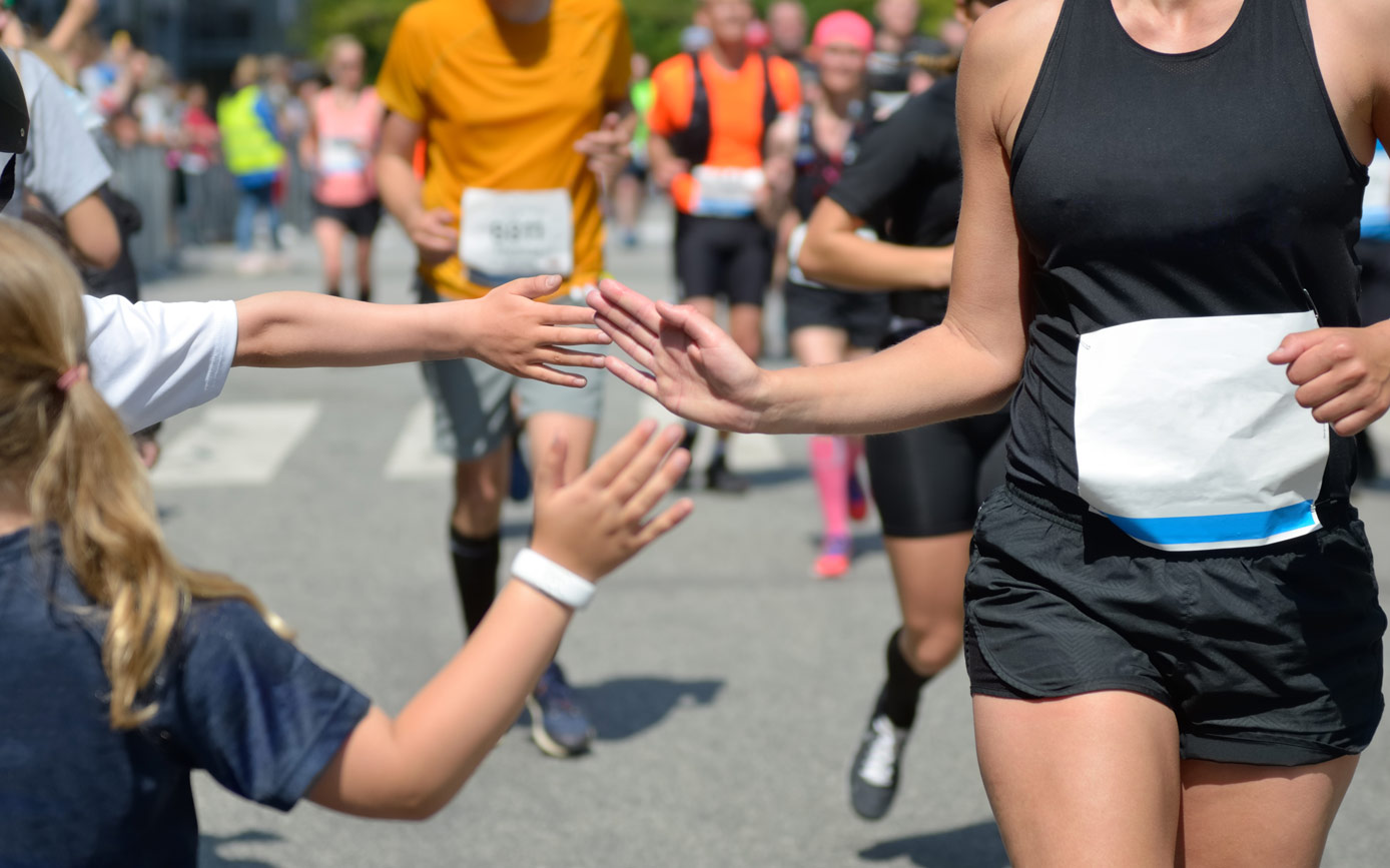 marathon-running-race-runners-support-road-race-child-s-hand-giving-highfive-kid-supporting-athletes-who-run-sport-concept
