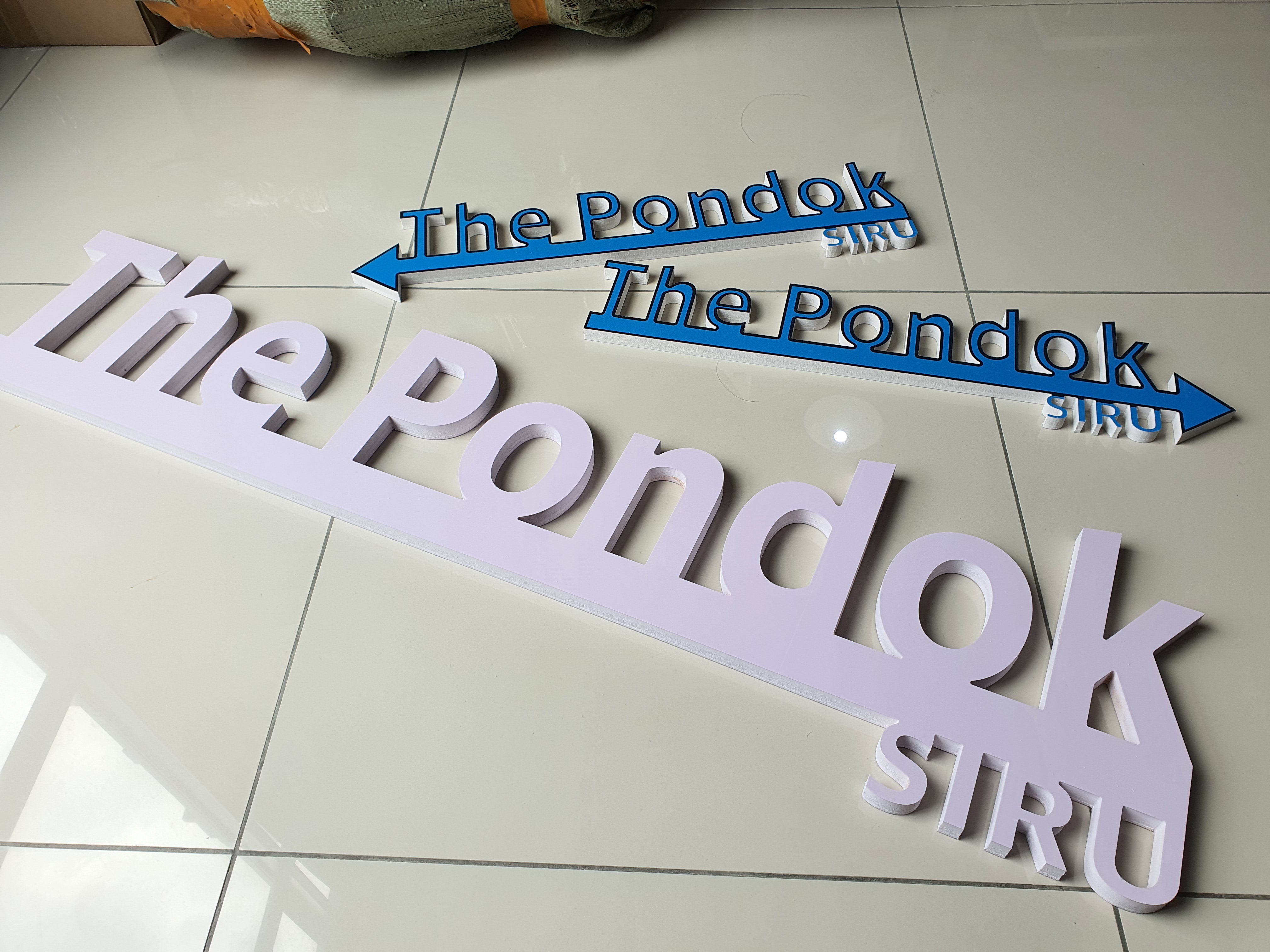 Die-cut PVC foam board lettering and directional signage for business display