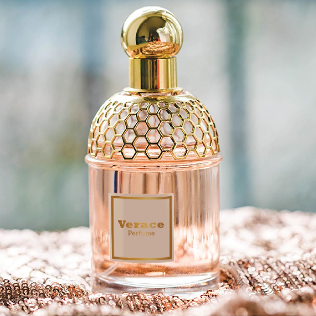 Synthetic product label sticker applied to a perfume bottle
