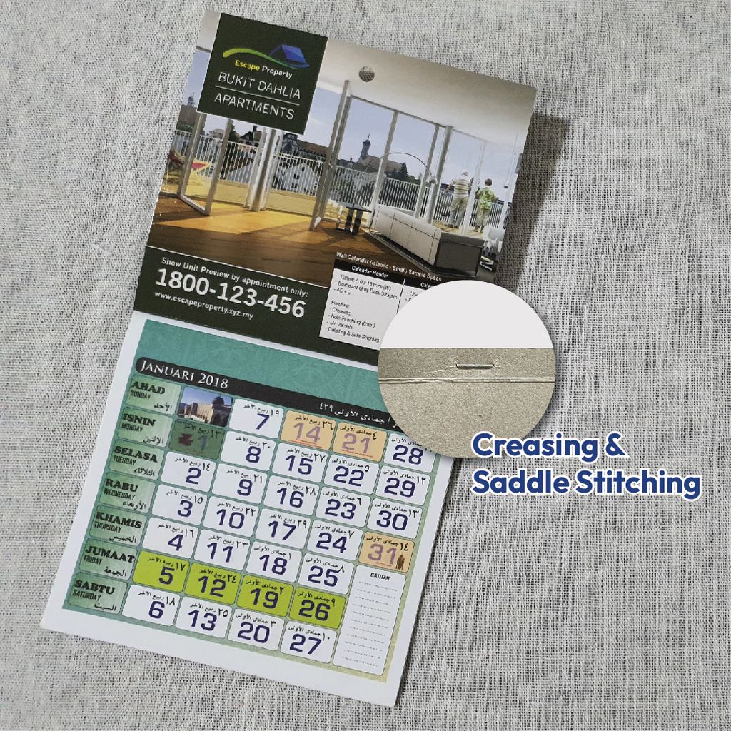 Creasing and saddle stitching detail on custom printed wall calendar