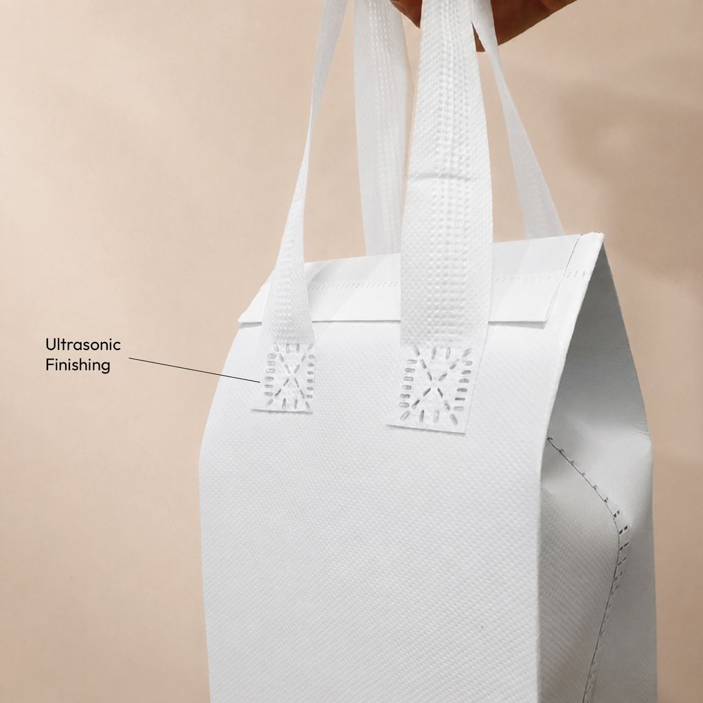 ultrasonic finishing detail on white non-woven thermal cooler bag handle