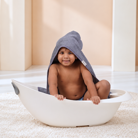 Toddler wrapped in Azure Blue bamboo cotton terry hooded towel