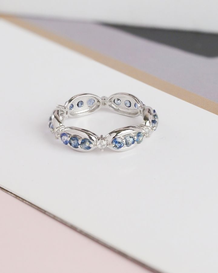 AXORA blue sapphire eternity ring