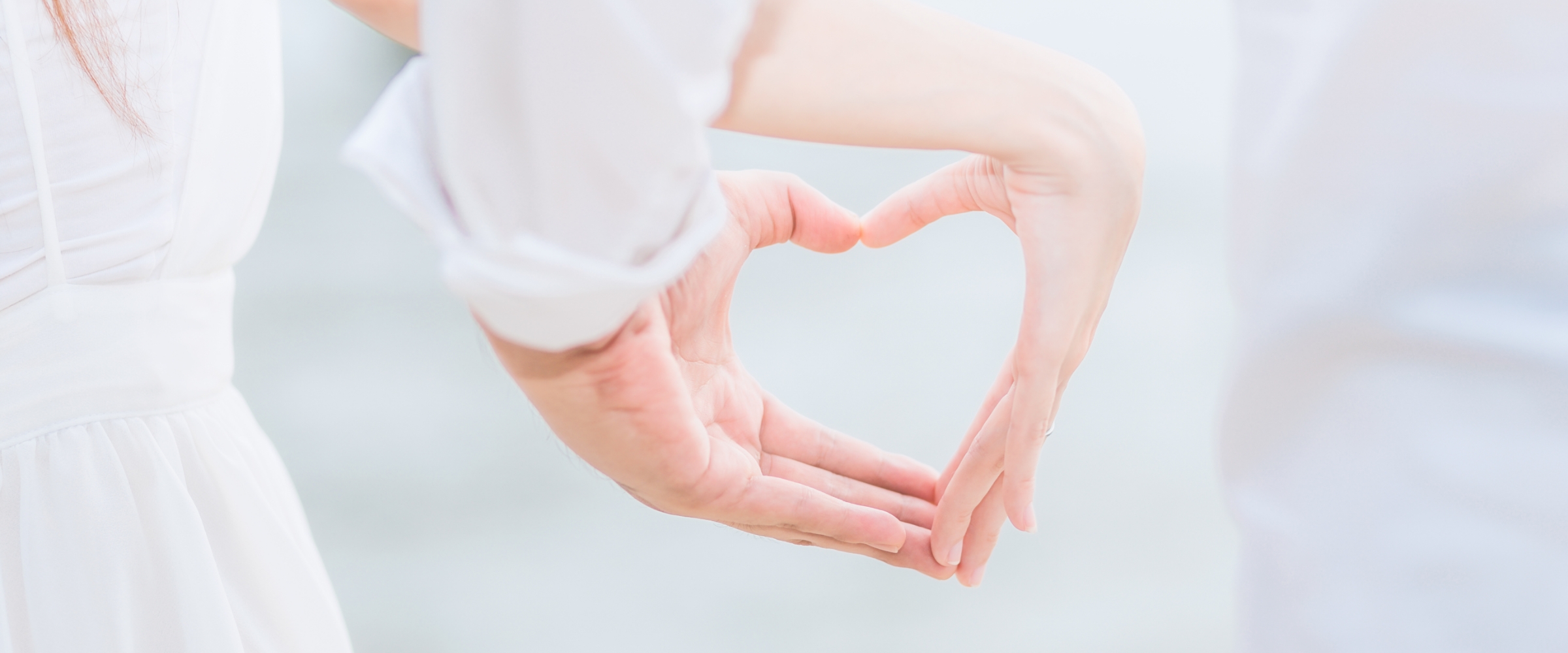 young-couple-making-heart-shape-with-hands