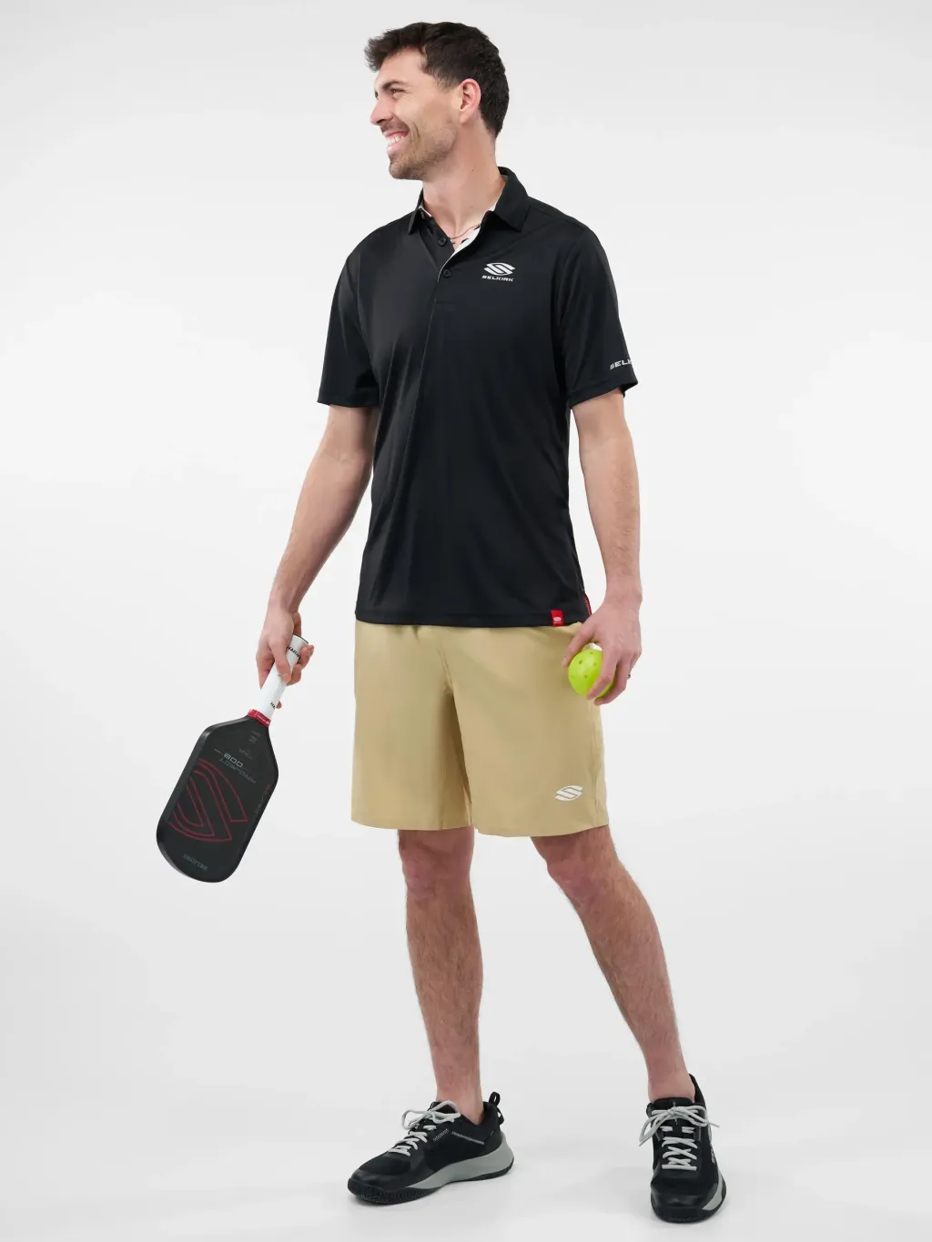 selkirk-pickleball-essentials-mens-sportwik-short-sleeved-polo-shirt-black-performance-shorts-gold-04