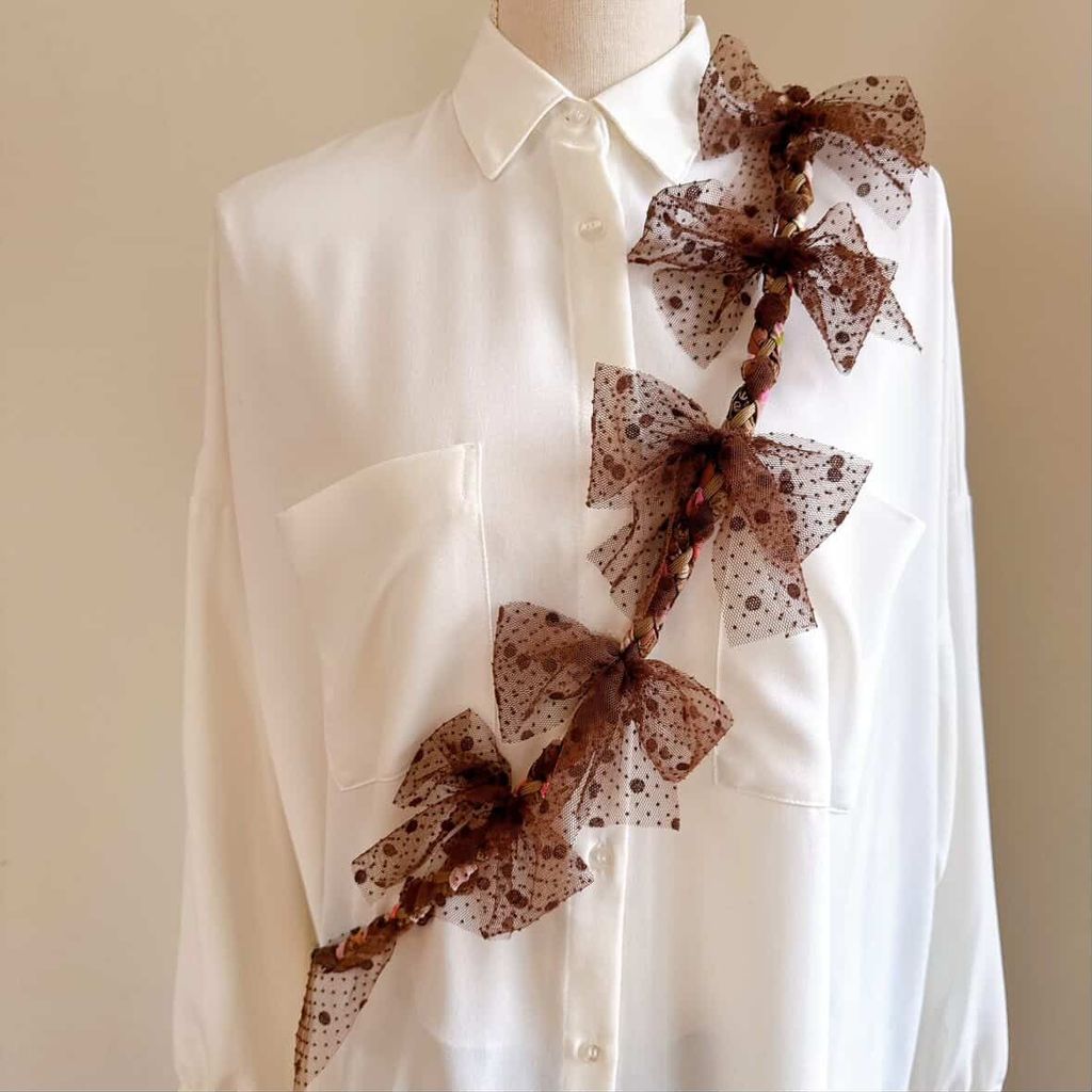 蝴蝶結咖色手機背繩_2026