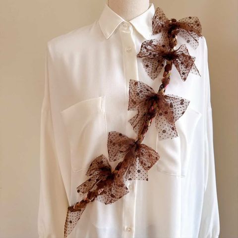 蝴蝶結咖色手機背繩_2026