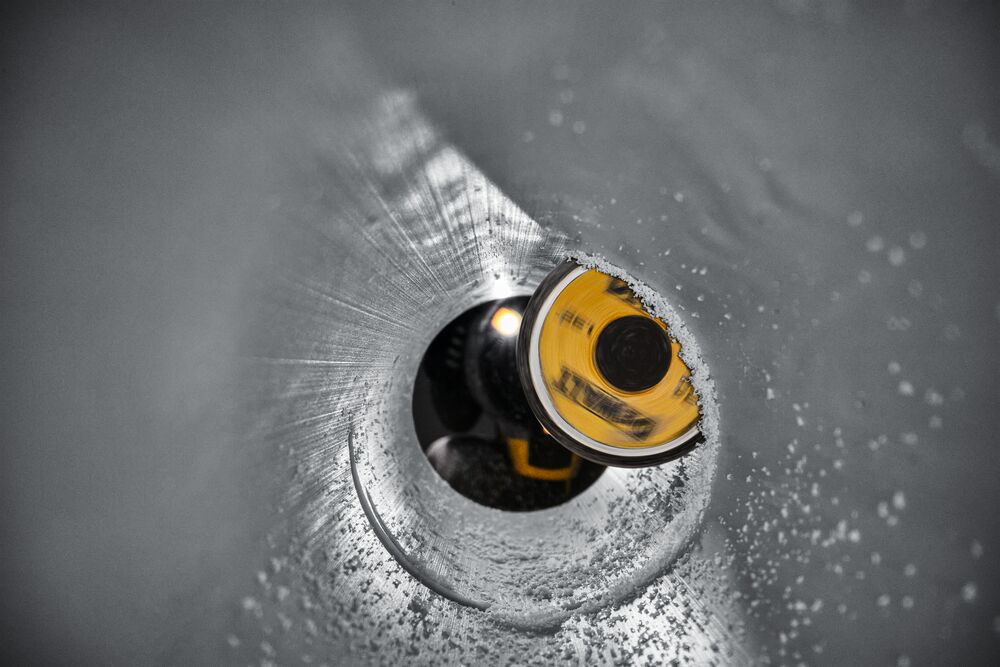 Internal view of pipe cutter cutting pvc pipe Internal view of pipe cutter cutting pvc pipe