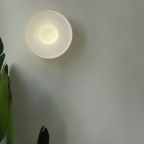 minimalist-round-wall-lamp-warm-light-on
