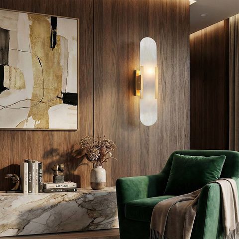 Modern luxury marble wall sconce on dark wood living room wall