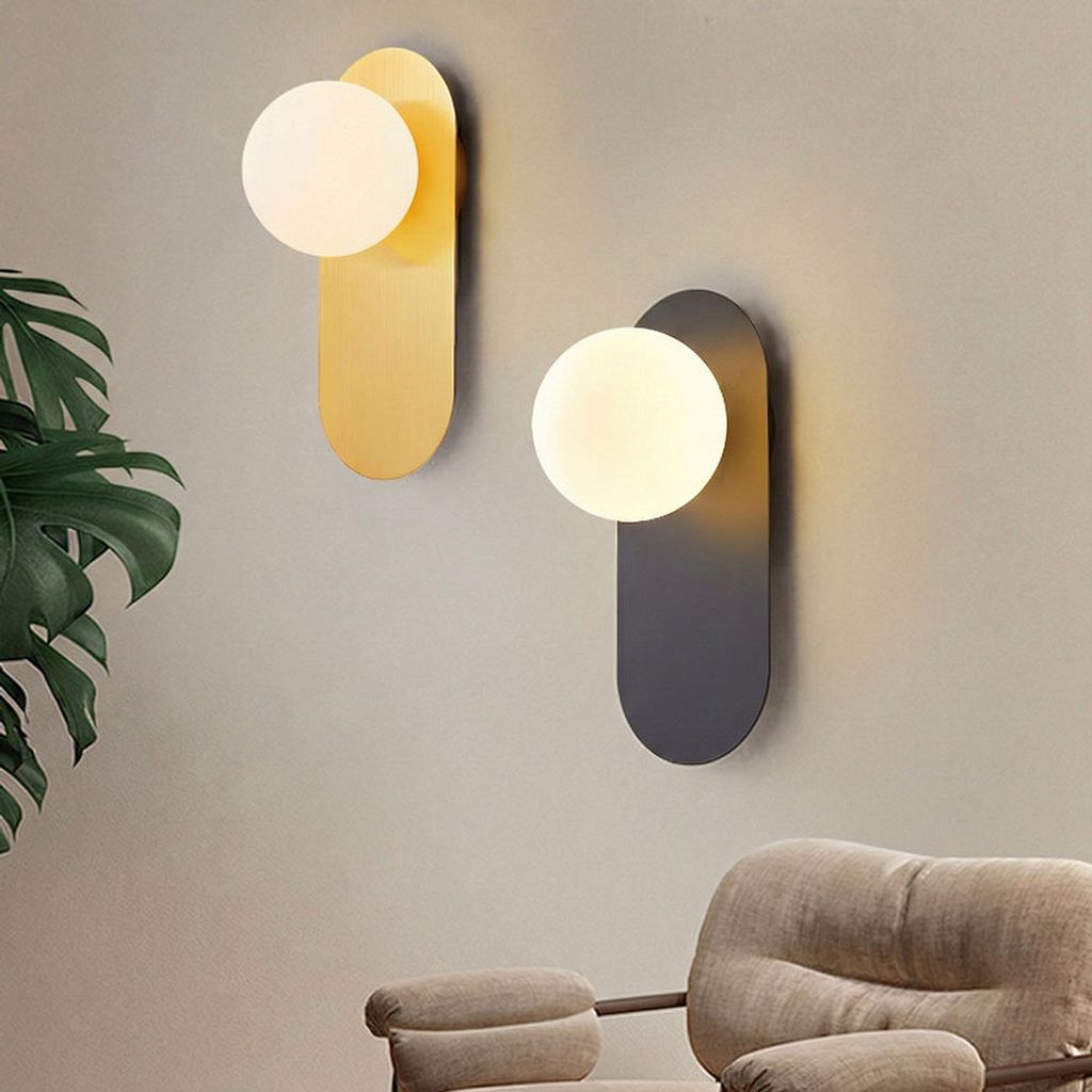 北歐輕奢風格橢圓形壁燈，展示金色拉絲與霧面黑色兩種款式，搭配圓形磨砂玻璃燈罩