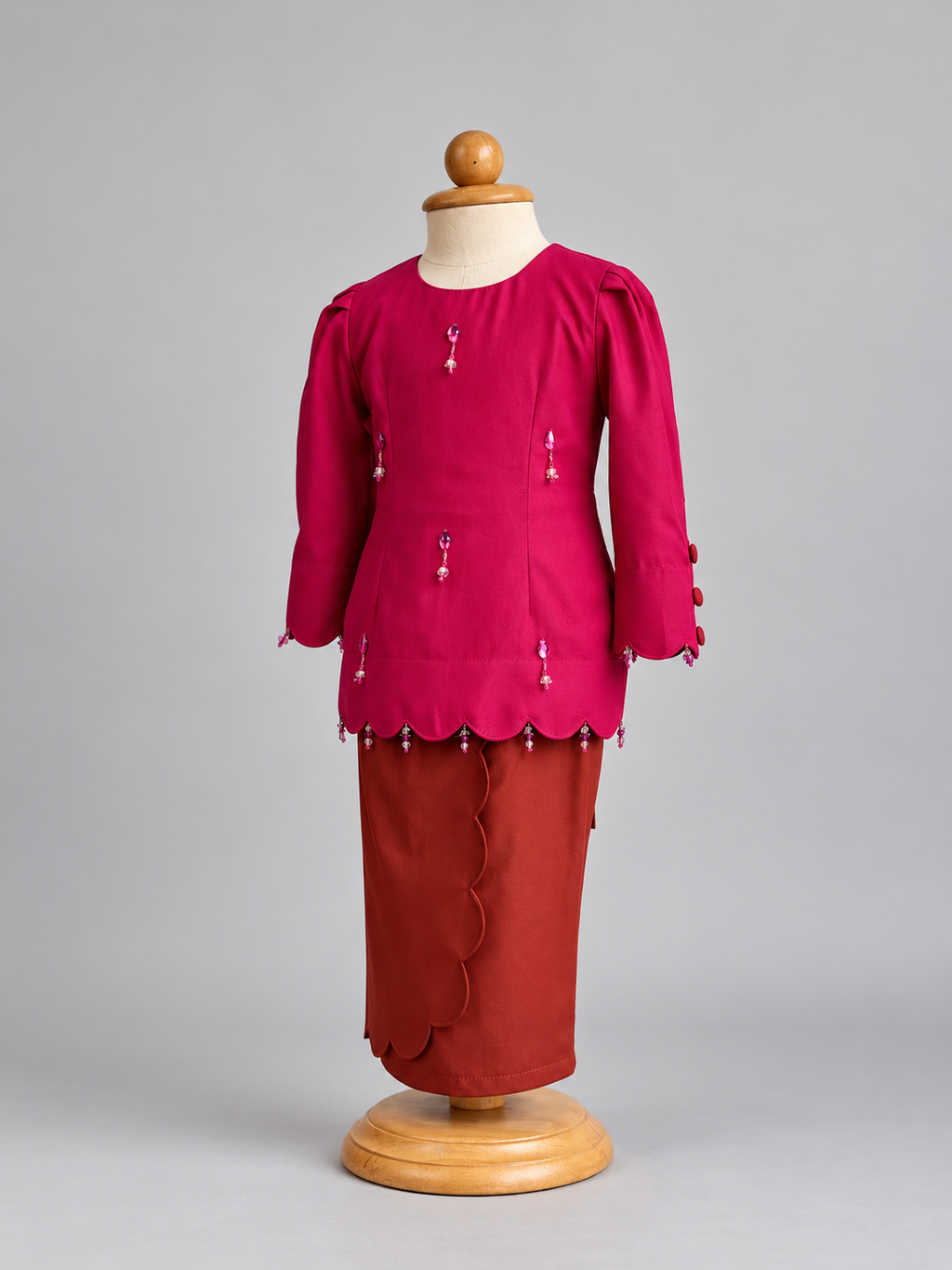Fuchsia Beaded Outfit on Wooden Mannequin