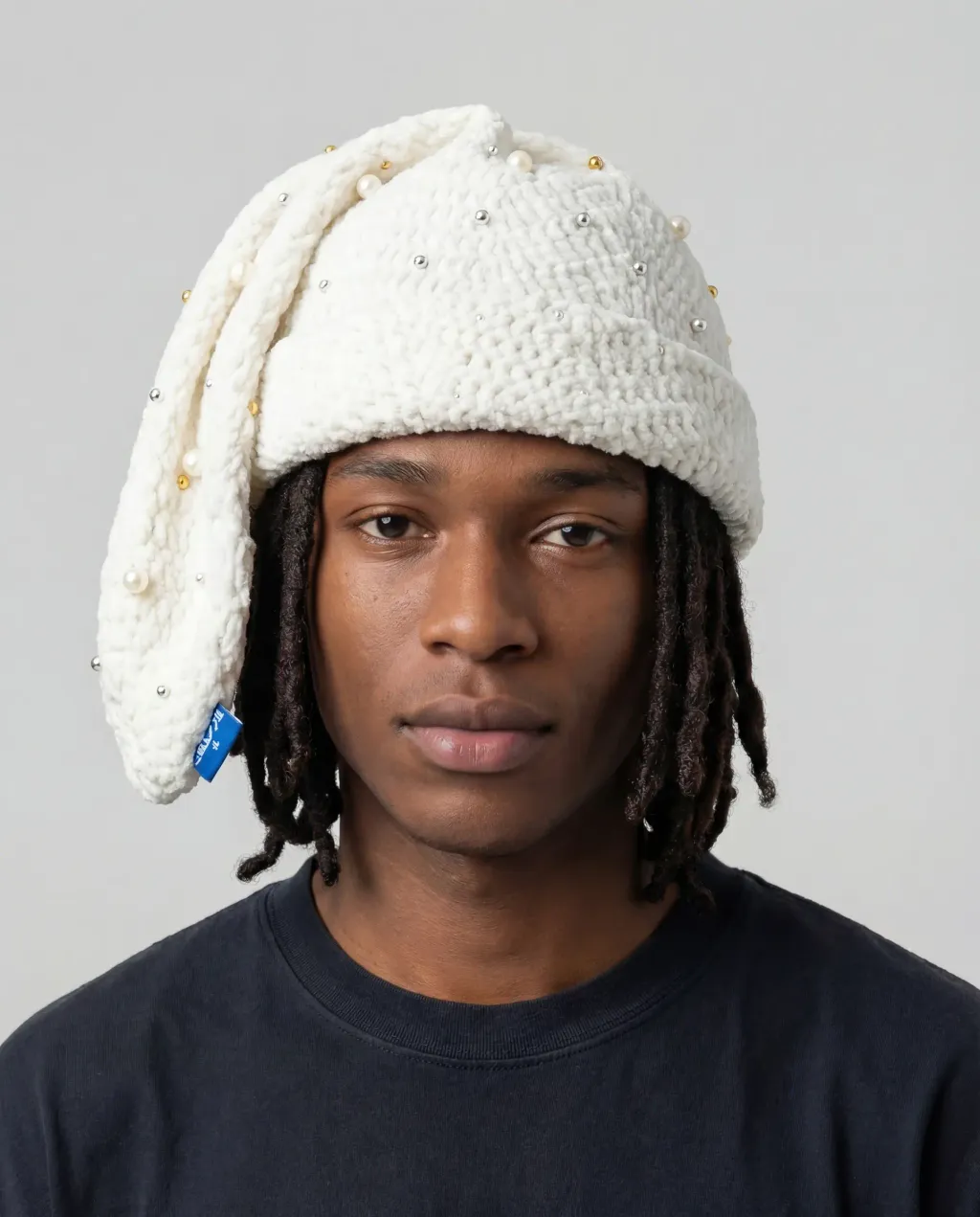 Generated_with_Kiveai_-_SOCK_HAT_PROMPT_HAVE_THIS_MODEL_WEARING_THIS_Arkyve_crochet_hatbut_tis_called_a_sock_hat_and_its_supposed_to_hang_to_the_side_but_the_part_hanging_shouldnt_gop_25fd8163-c7d8-487f-a485-9869b2dbd2f1