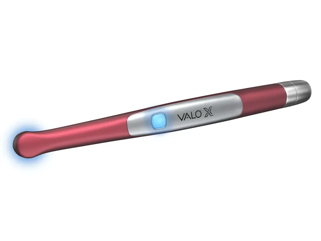 6497-VALO-X-Colors-Curing-Light-Pink-lying-down-EQUIPMENT