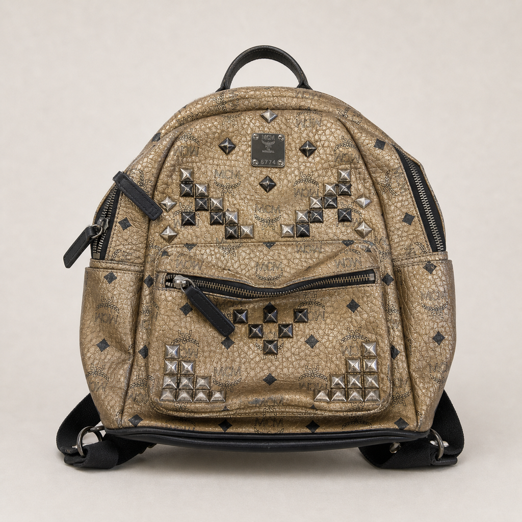 014_16640436_mcm_studded_backpack_brown_gold_ai_lightbg