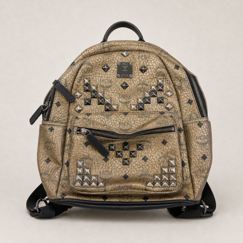 014_16640436_mcm_studded_backpack_brown_gold_ai_lightbg