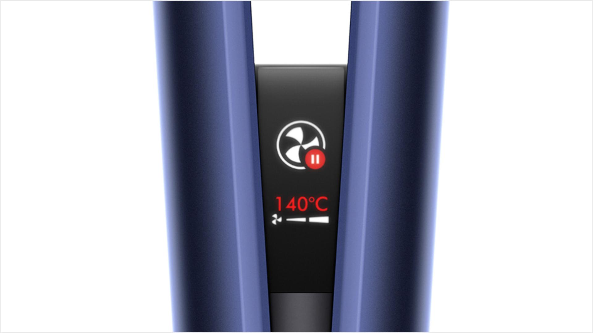 Close-up of the Dyson Airstrait LCD screen, showing the auto-pause animation.