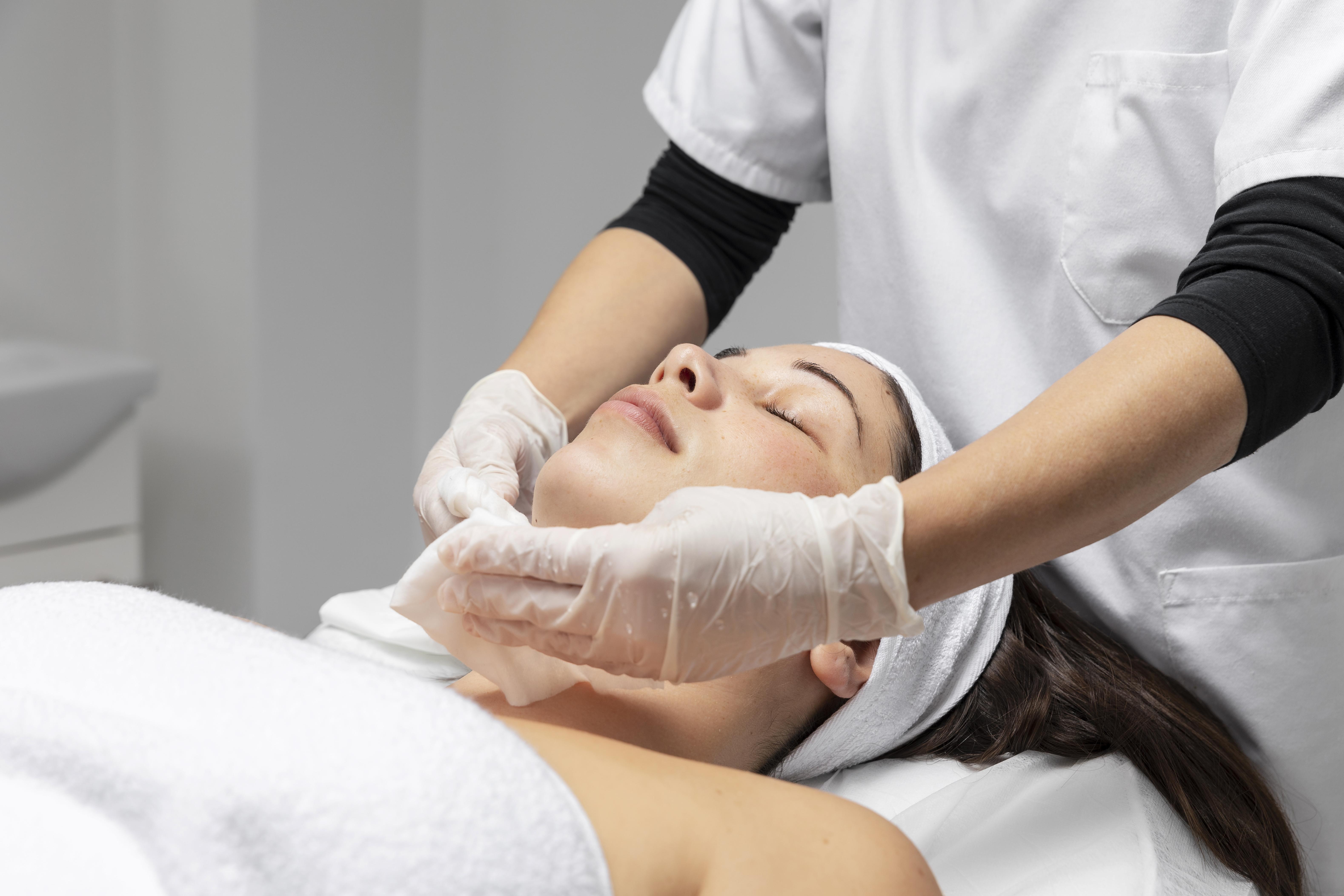 young-woman-having-facial-skincare-treatment