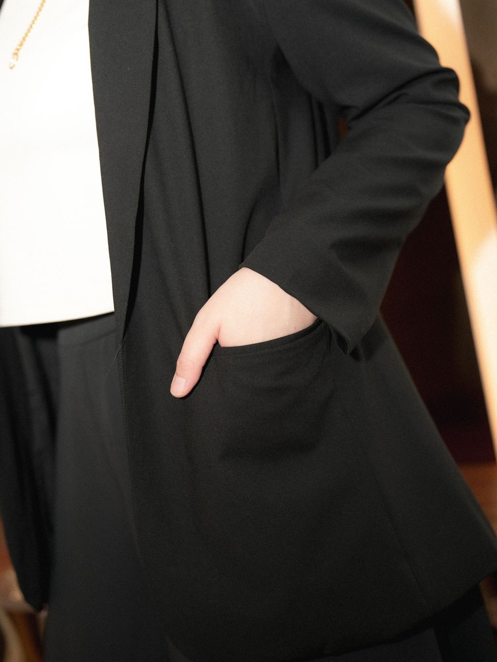 Tailored plus-size blazer with minimalist front and sharp lapels