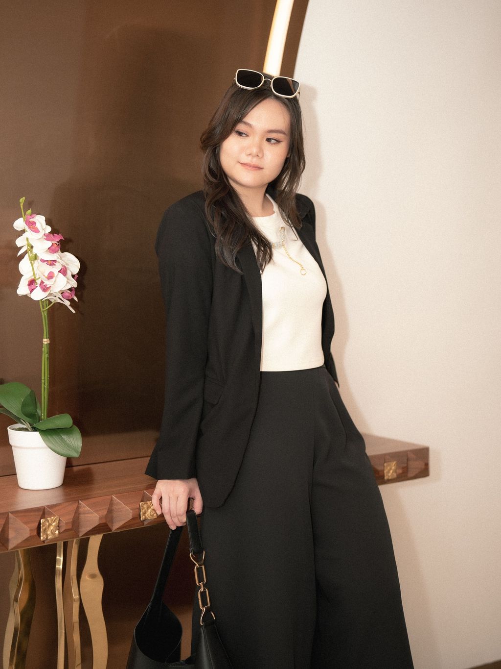 Model posing in Sleek Curve Blazer with confident posture and smooth fit