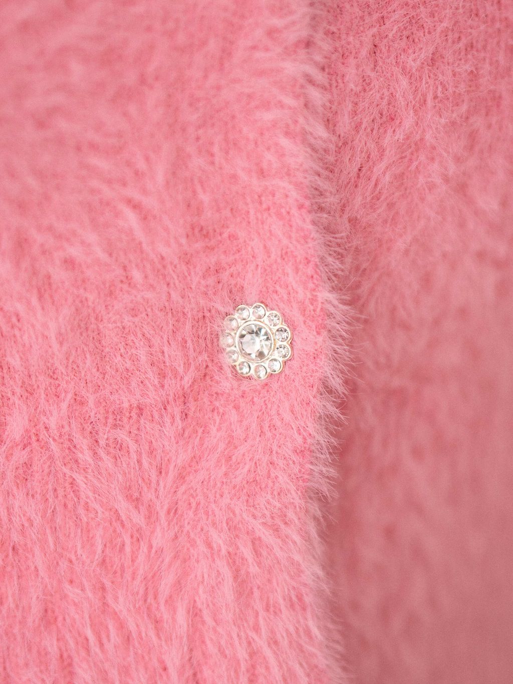 Detail shot of stretchable knit material with subtle sheen and lightweight feel