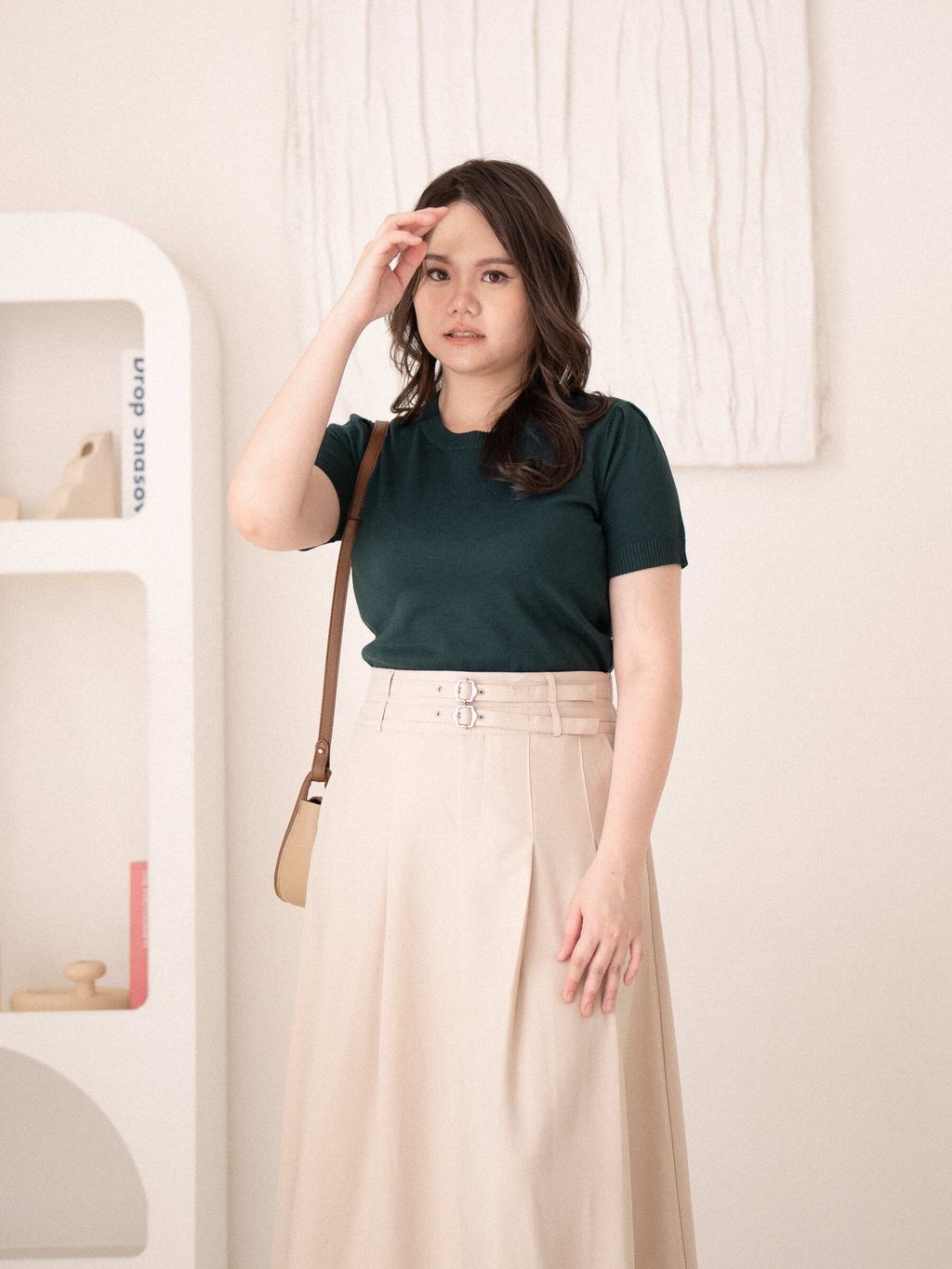 Green Soft Fit Knit Tee tucked into beige midi skirt