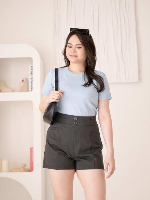 Plus-size model wearing light blue Soft Fit Knit Tee