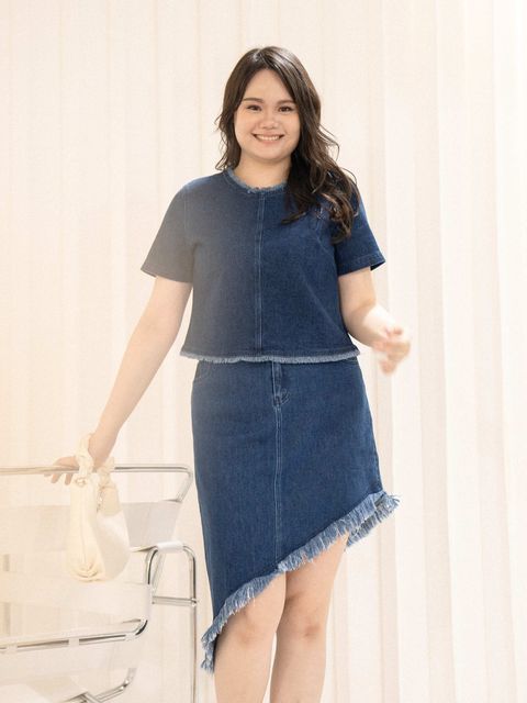 Front view of structured denim blouse featuring raw-edge details