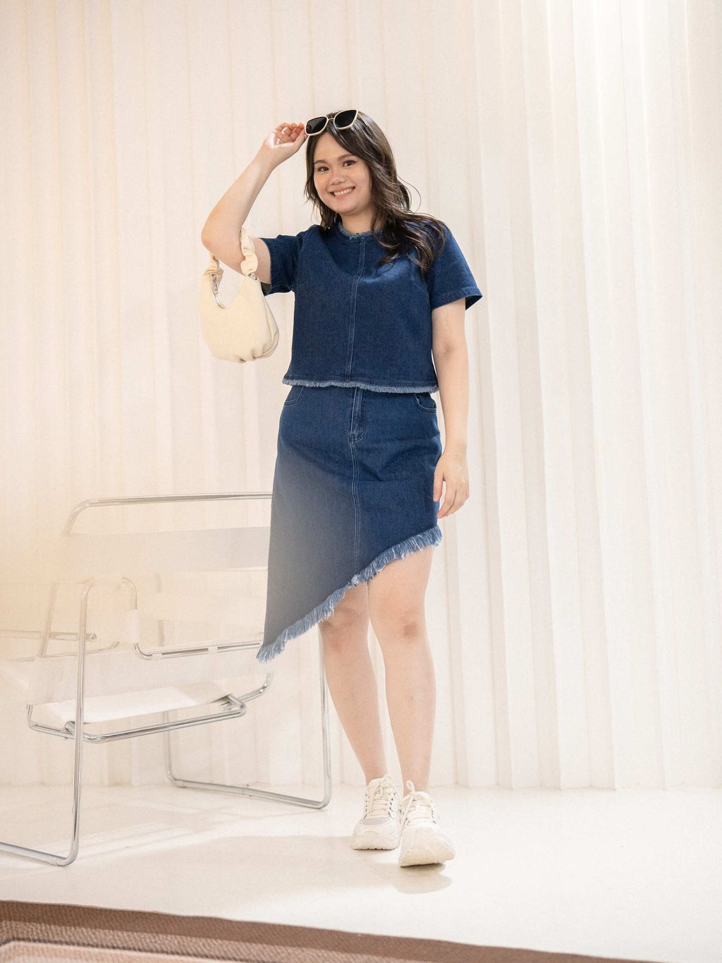 Close-up of denim fabric with frayed trim around the neckline