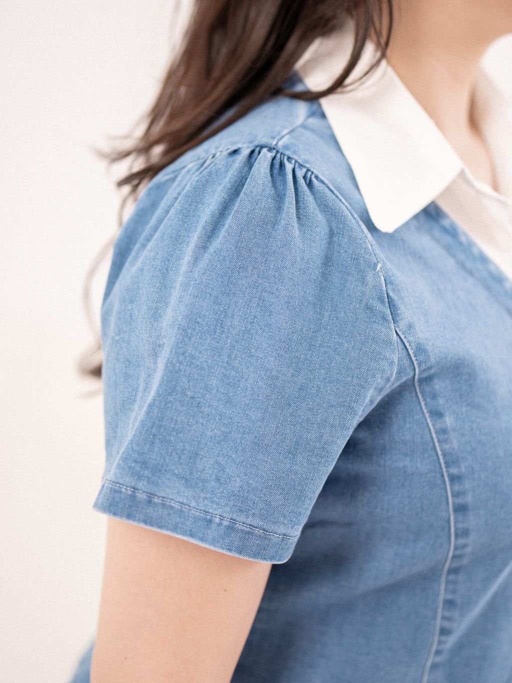 Close-up of puff short sleeve on denim top