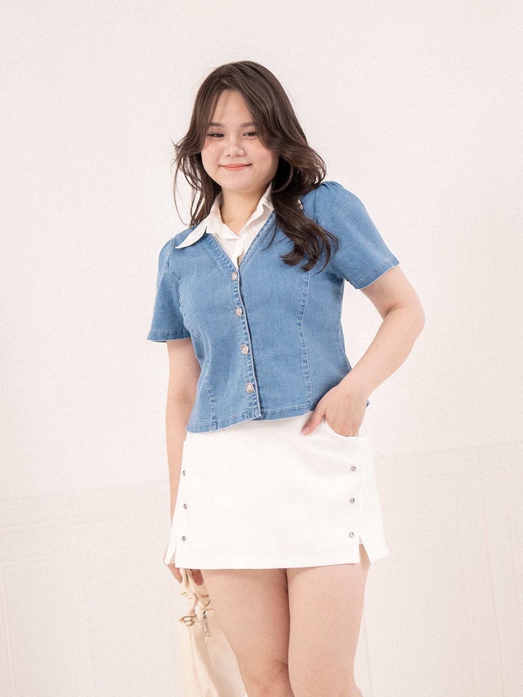 Vintage-style metal buttons on denim short-sleeve top