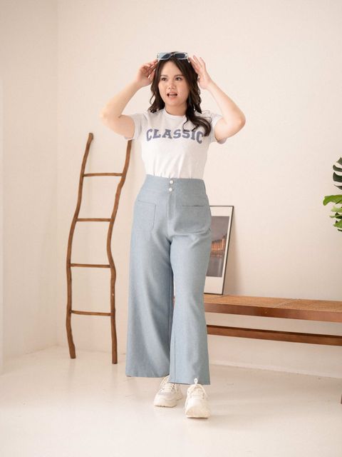 Urban Grace Pants styled casually with sneakers and a slogan tee for a relaxed weekend look.