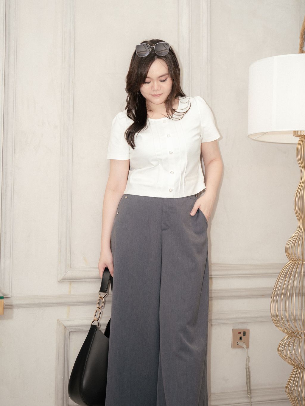 Office chic look with Grace Fit Pants paired with structured white top.