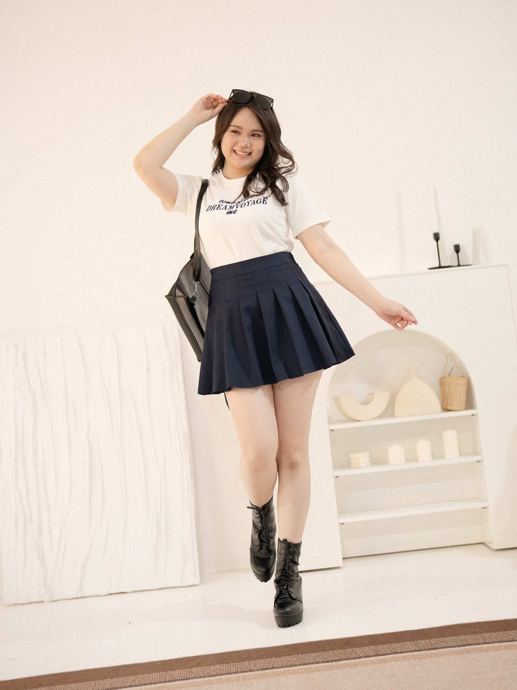 Preppy plus-size outfit with flare pleated mini skirt and graphic tee