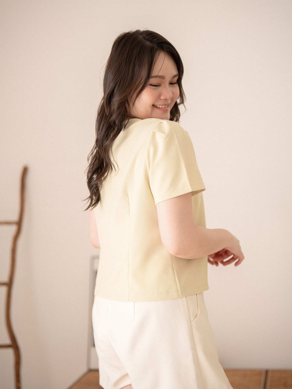 Back view of the top with neat construction and clean silhouette.