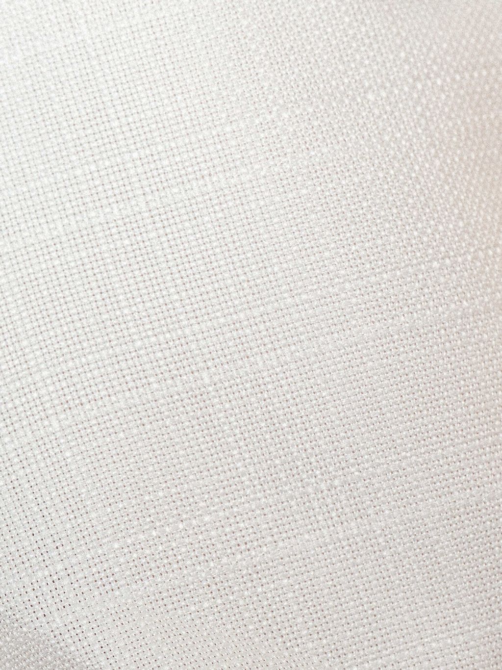 Close-up of tweed texture showing the soft, structured weave with subtle golden threading.